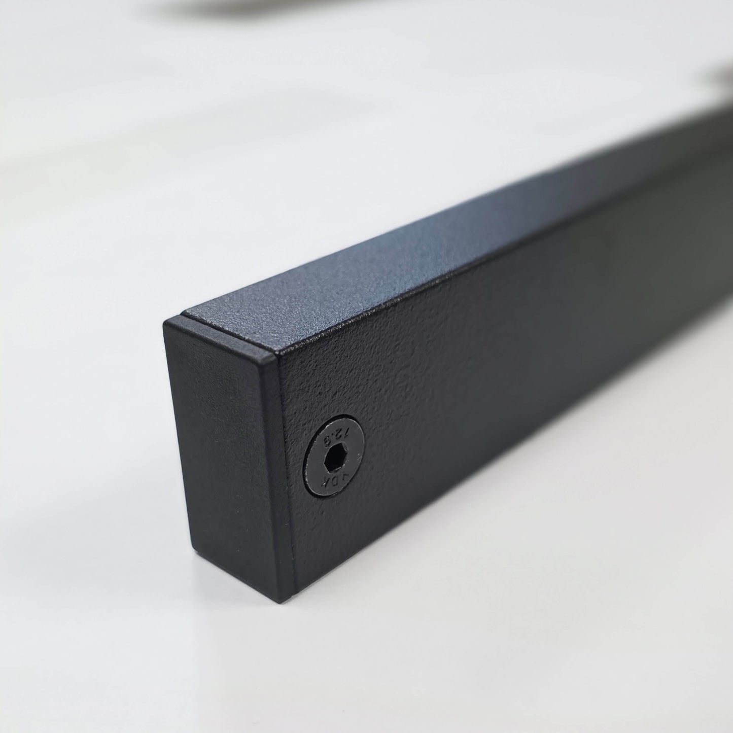 detail view of pinch weld cover with black accent screw