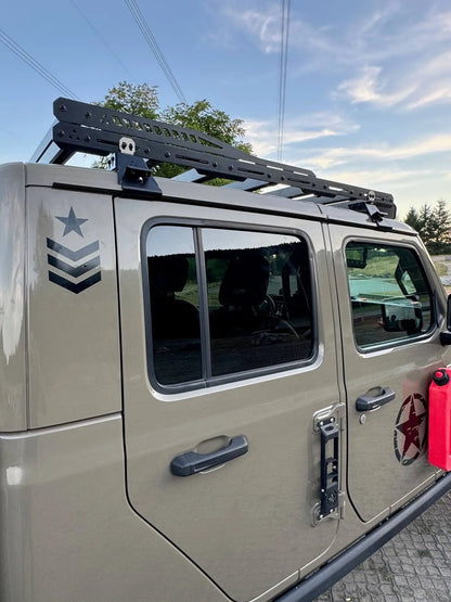 Jeep Gladiator with roof rack and star emblem on a clear day