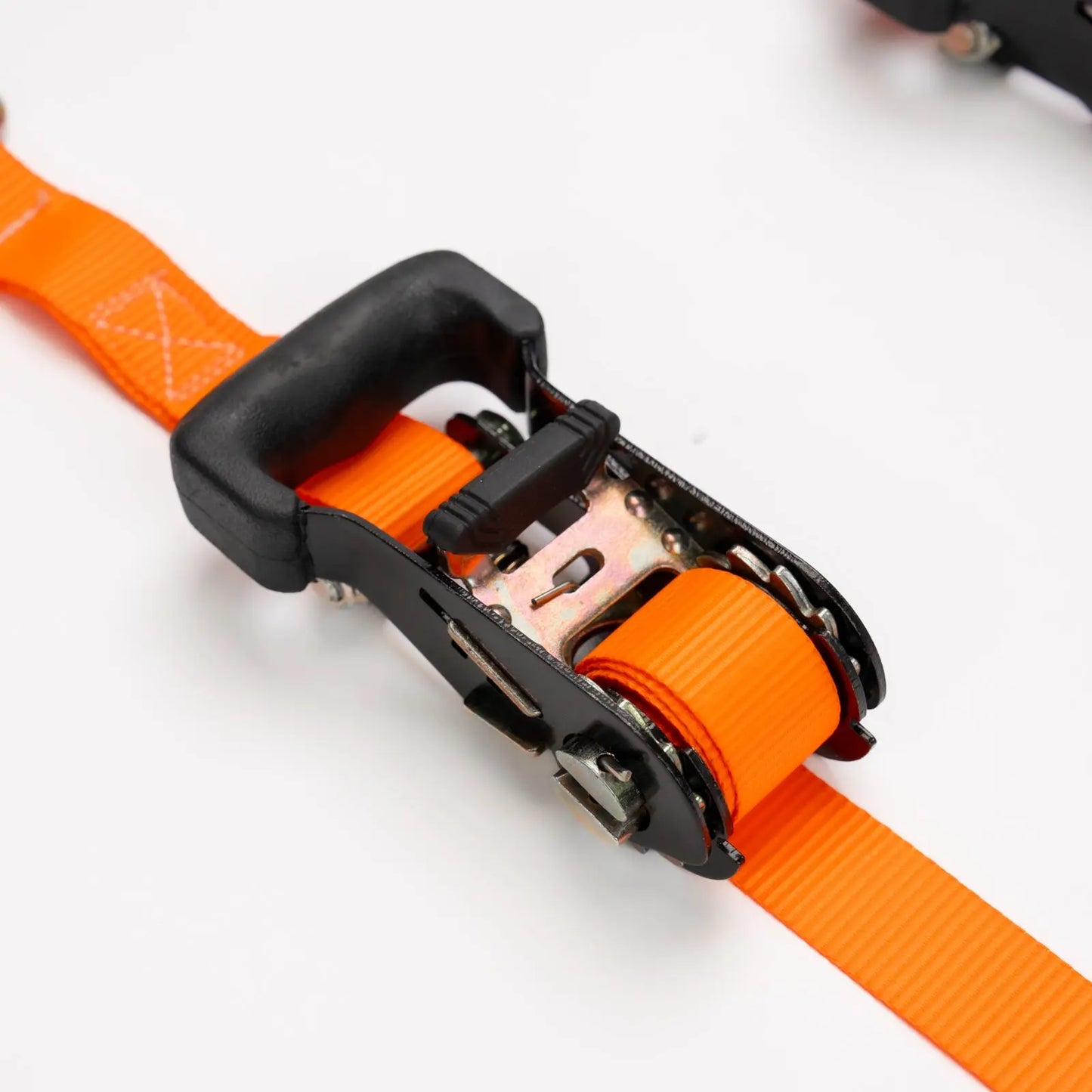 Close-up of an orange strap with a black buckle on a white background