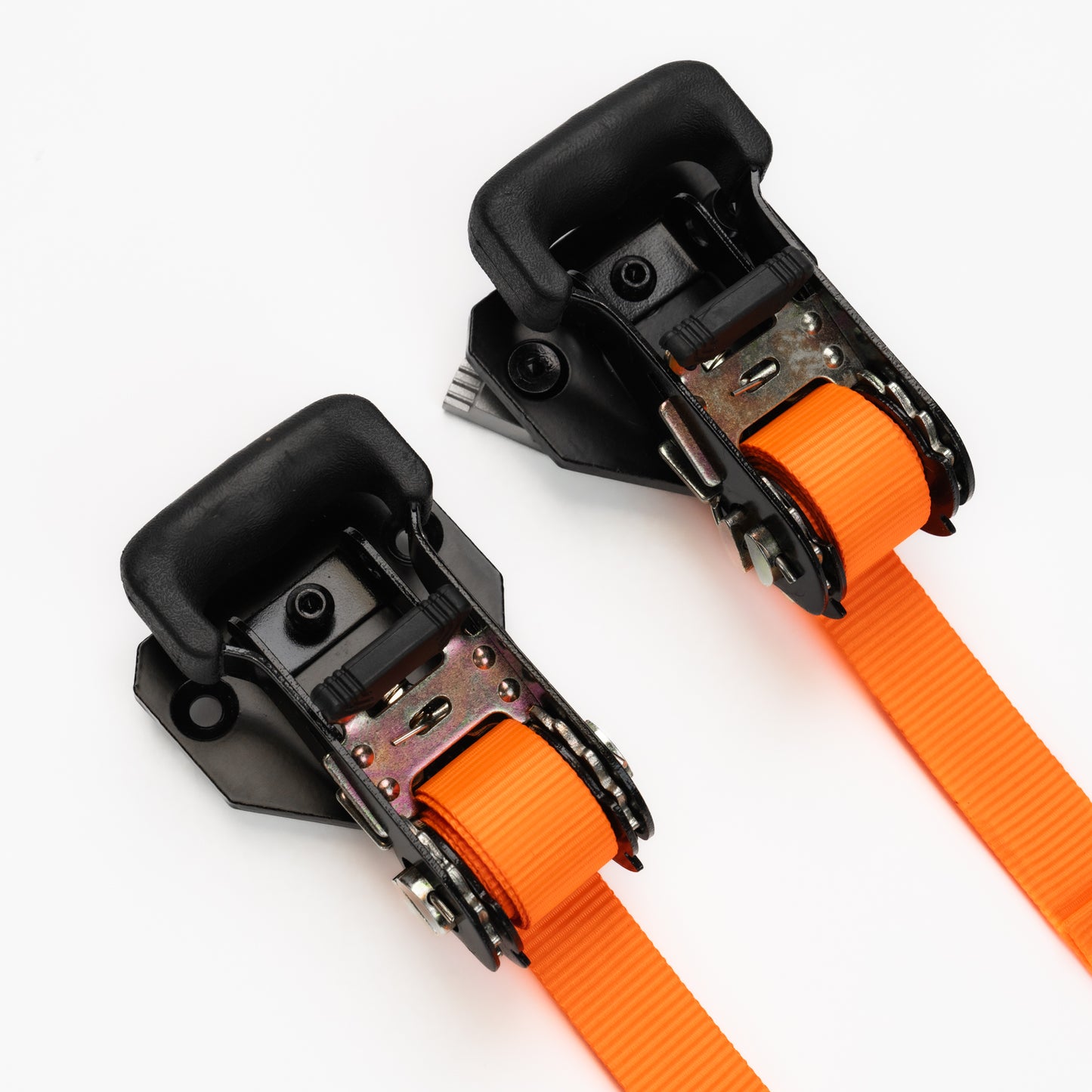 Two orange straps with black metal clamps on a white background