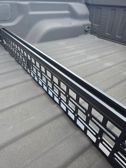 Black powder coated G2 Bed divider installed on Jeep Gladiator with exposed top rail.