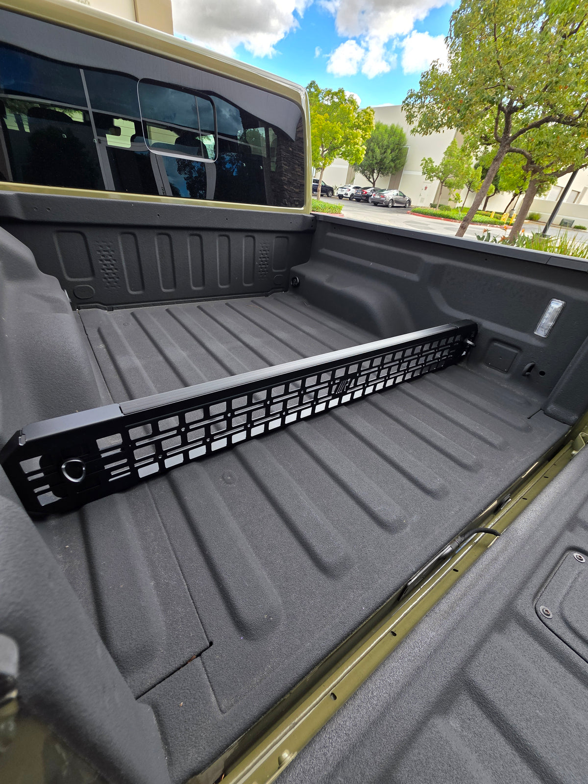 Black powder coated G2 Bed divider installed on Jeep Gladiator.