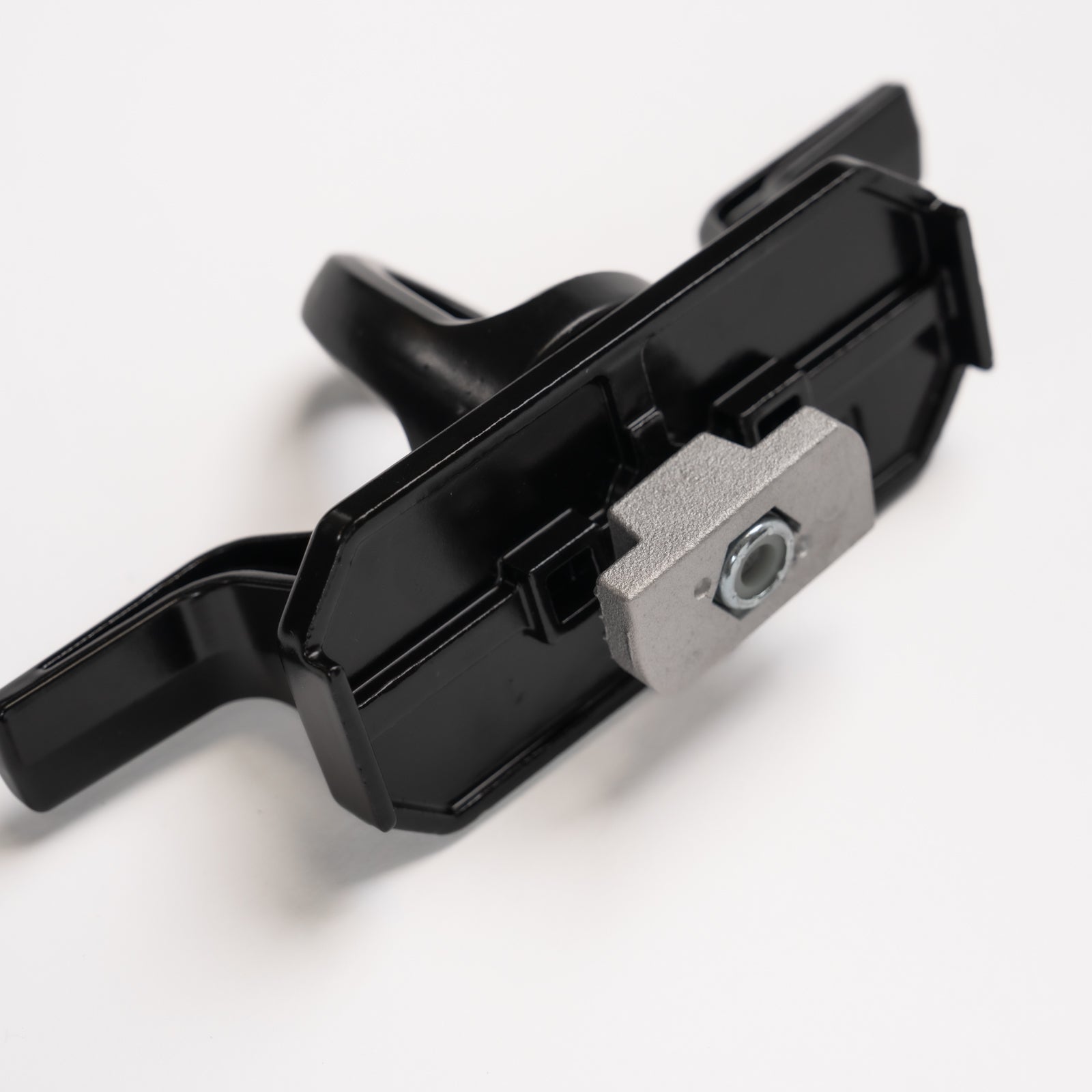 Tie down for strut channel mounting nut