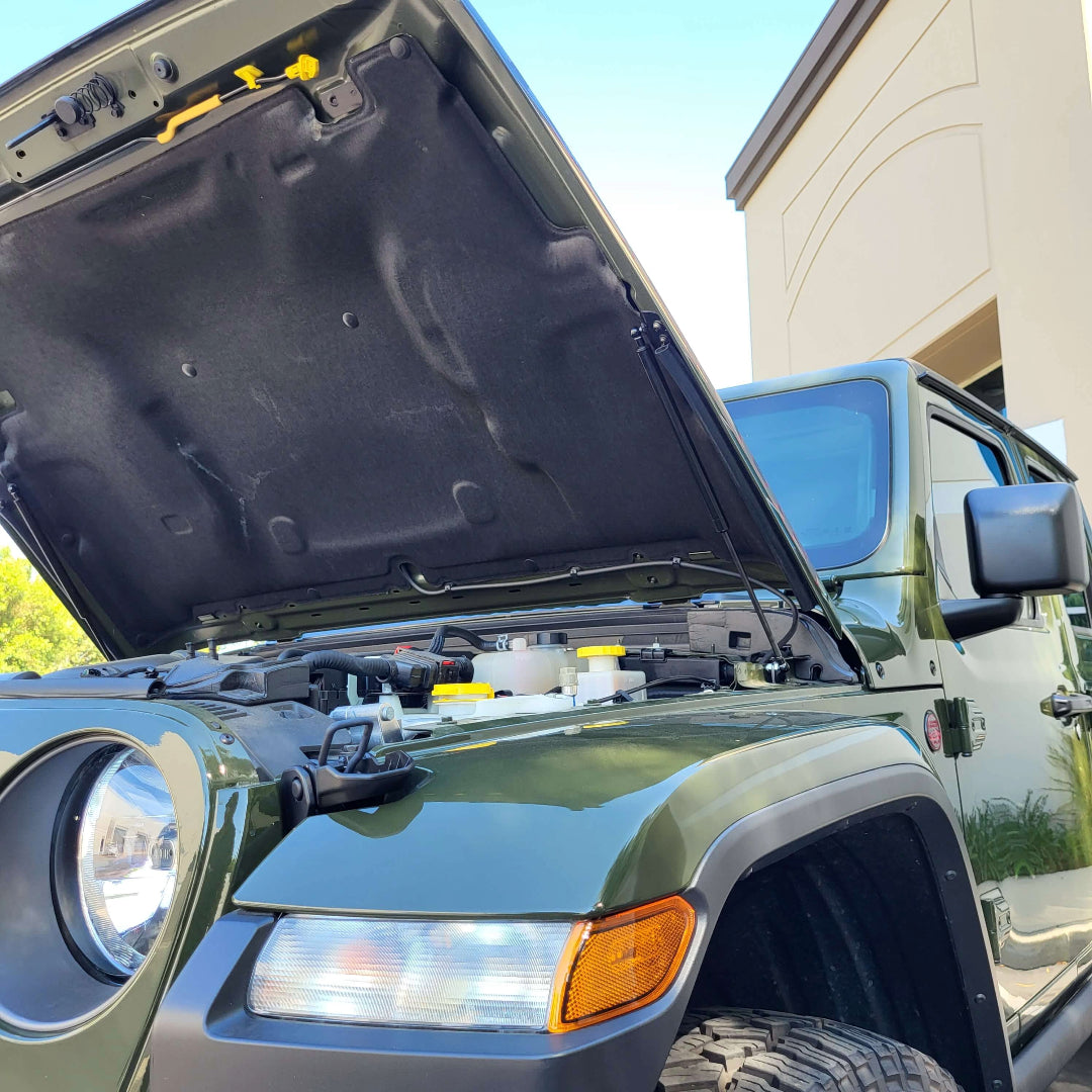 Jeep hood strut kit installed close up