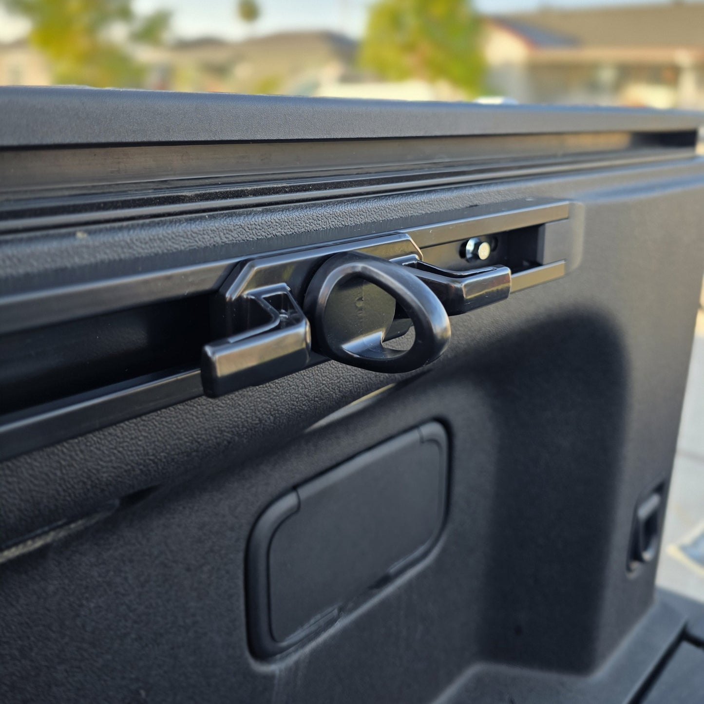 Rivian R1T cargo rail tie down